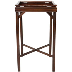 Side view of an antique mahogany end table with a simple fluted design and a cross bar between the legs.