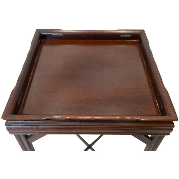Top view of a square antique mahogany end table.