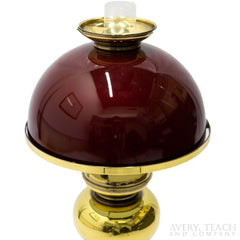 A close up of the shade on a vintage hurricane lamp.