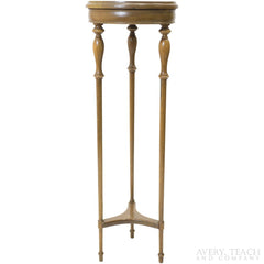 Side view of a tall wooden plant stand.