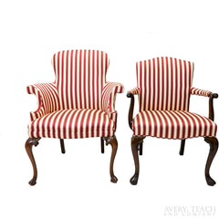 A pair of red and white striped parlor chairs with cabriole legs, the right one with an open arm style.