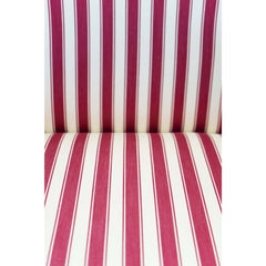 Close up of the red and white striped fabric on antique parlor chairs.