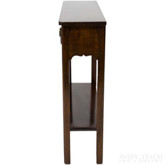 Side view of a vintage Stickley end table with a bottom shelf.